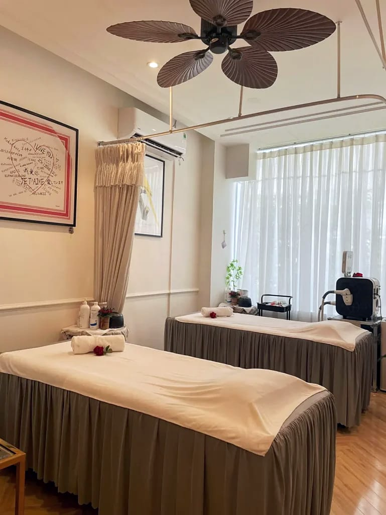 Private waxing treatment room with two prepared beds — Saigon